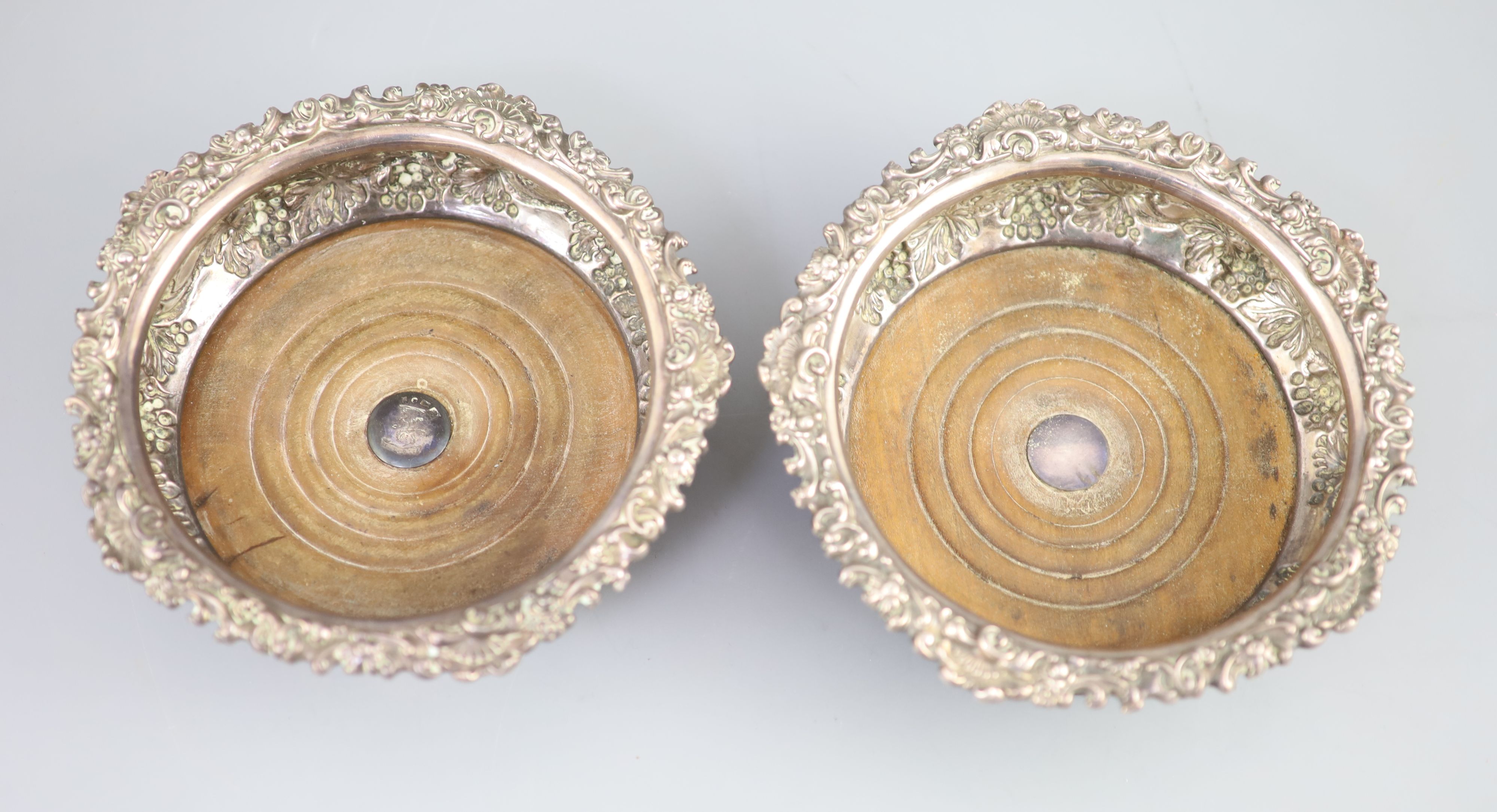 A pair of George IV silver wine coasters, S.C. Younge & Co, Sheffield, 1824, 16.7cm,